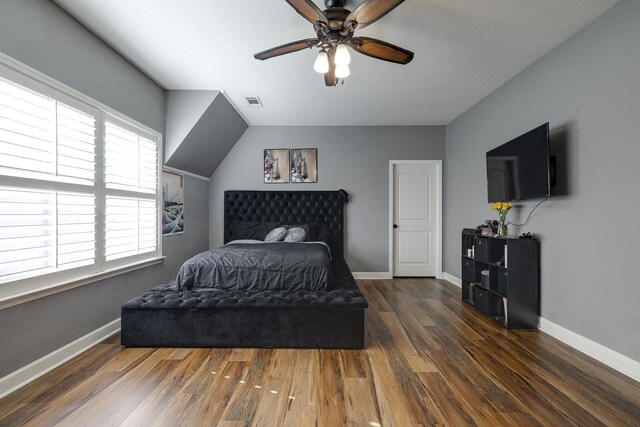 bedroom with ceiling fan and dark hardwood / wood-style floors