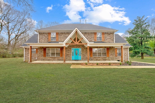 view of front of property with a porch and a front lawn