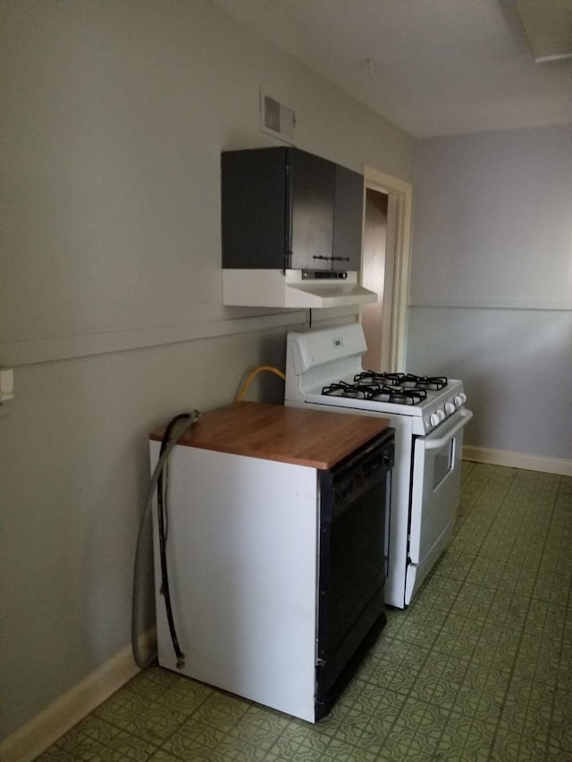 kitchen with white range with gas cooktop