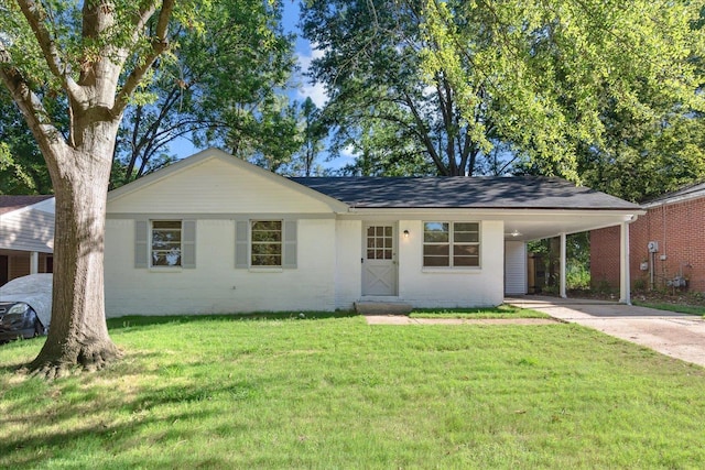 ranch-style house with a carport and a front lawn