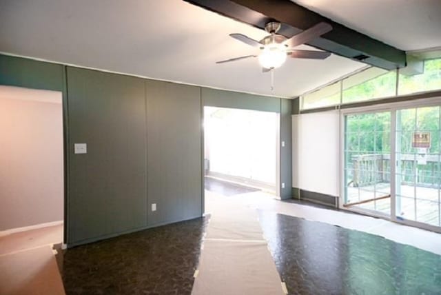 carpeted spare room with lofted ceiling with beams and ceiling fan