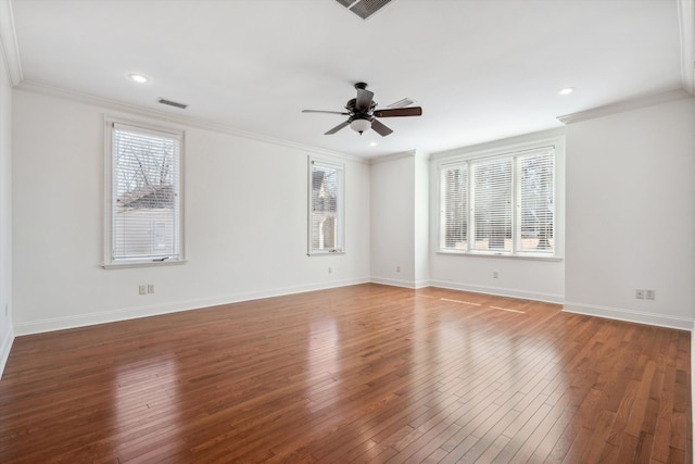 empty room featuring dark wood-type flooring, ornamental molding, and ceiling fan