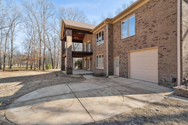 rear view of house featuring a garage