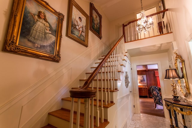 stairway with an inviting chandelier