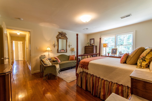 bedroom with hardwood / wood-style flooring