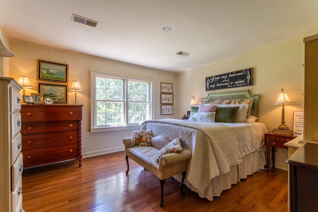 bedroom with wood-type flooring