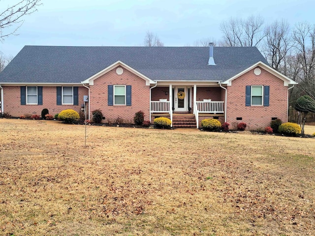 ranch-style home with covered porch and a front lawn