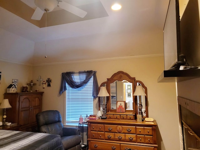 bedroom with ceiling fan, ornamental molding, a tray ceiling, and vaulted ceiling