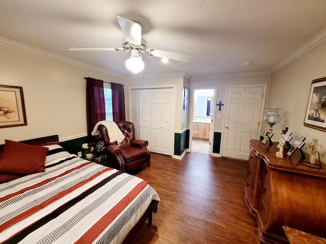 bedroom featuring ceiling fan, ornamental molding, dark hardwood / wood-style flooring, and a closet