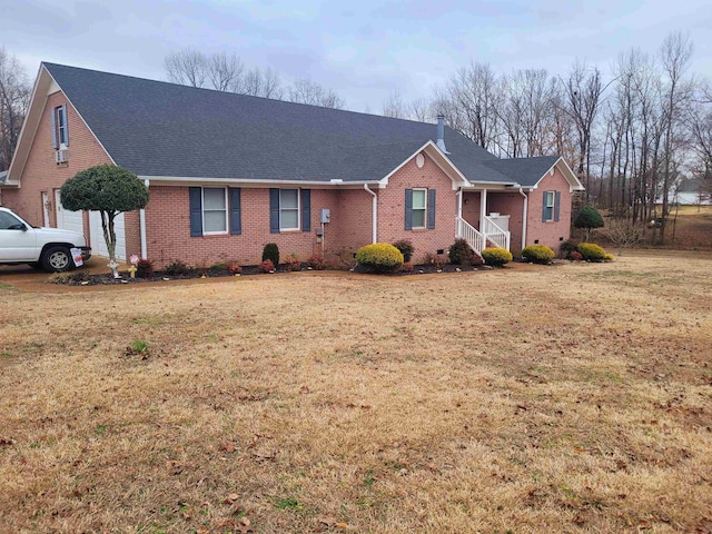 ranch-style home with a front lawn