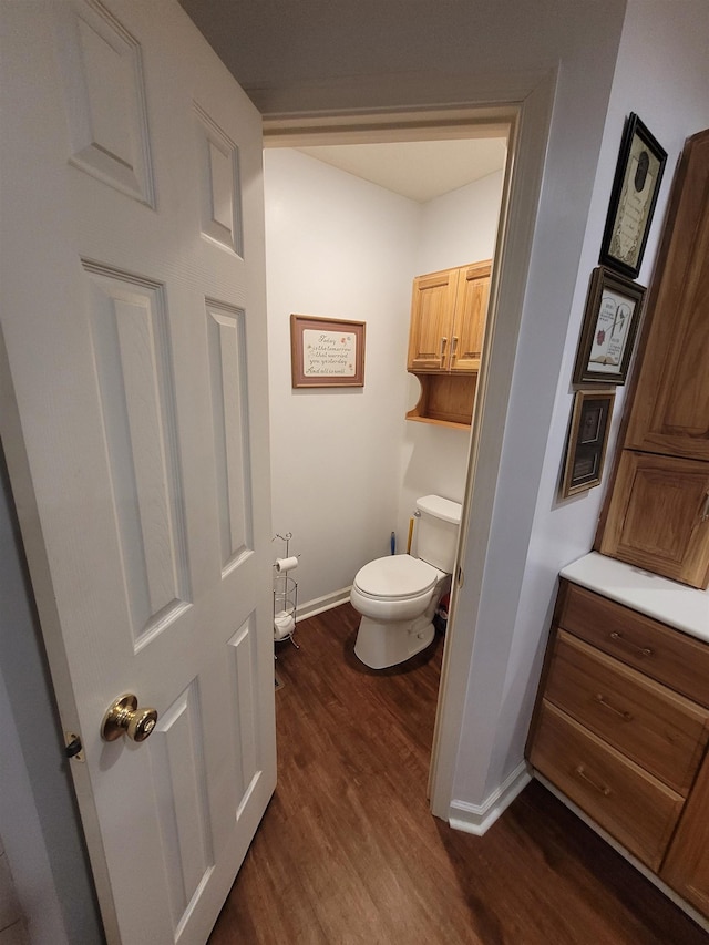 bathroom featuring toilet and hardwood / wood-style floors