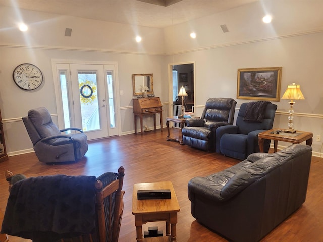 living room with lofted ceiling and hardwood / wood-style floors