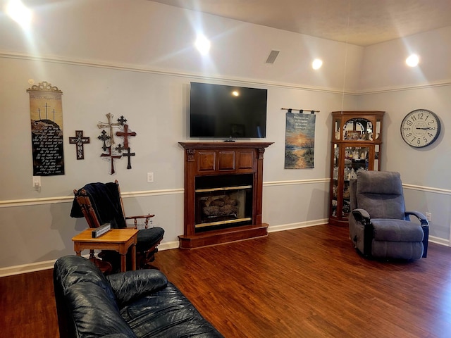 living room with dark hardwood / wood-style floors and vaulted ceiling