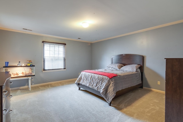 bedroom with ornamental molding, light carpet, visible vents, and baseboards