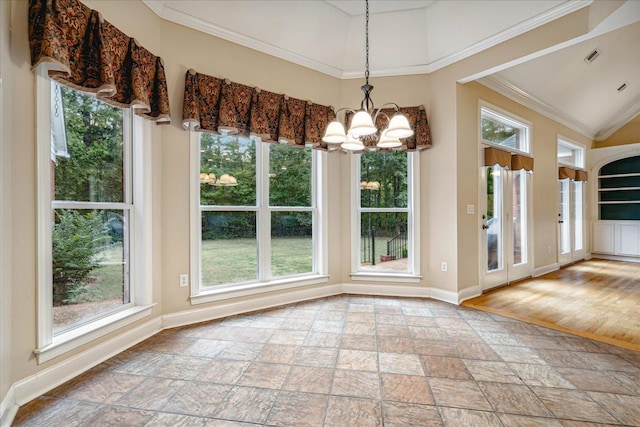 unfurnished dining area with crown molding and a chandelier