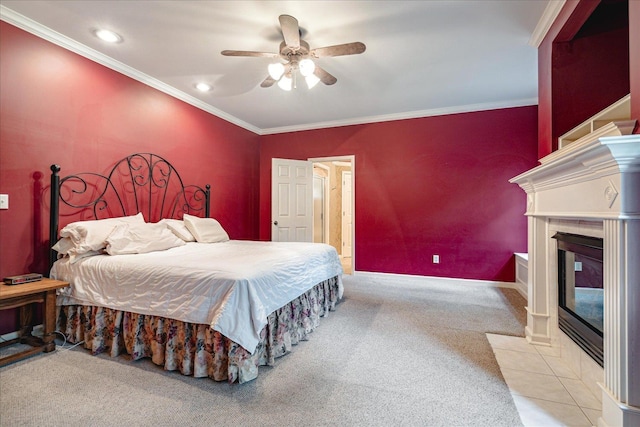 bedroom with ornamental molding, light carpet, and ceiling fan