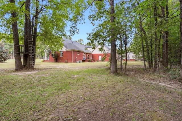 view of yard with central AC unit