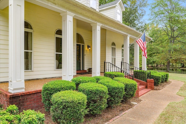 entrance to property featuring a porch