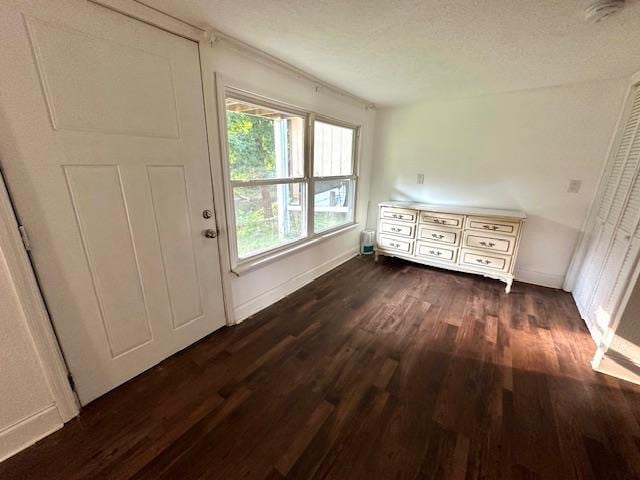 doorway to outside with dark hardwood / wood-style floors