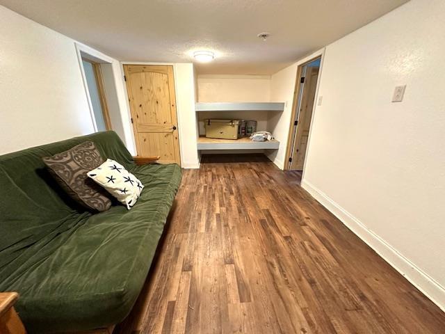 unfurnished living room featuring dark hardwood / wood-style floors