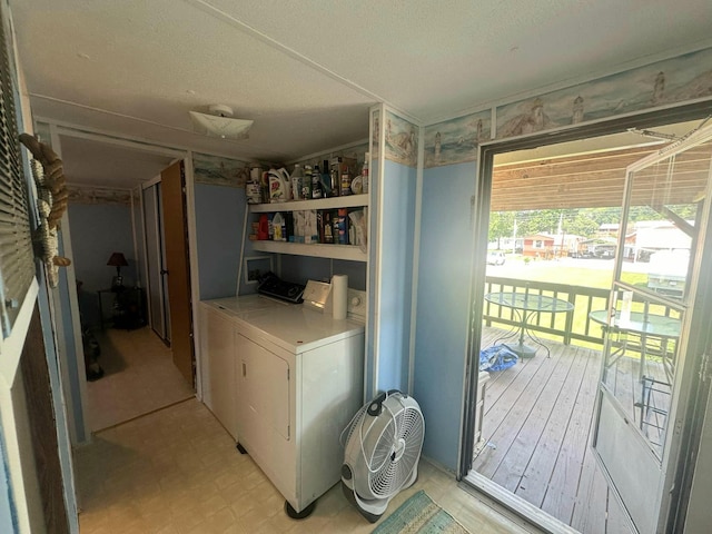 clothes washing area featuring washing machine and clothes dryer