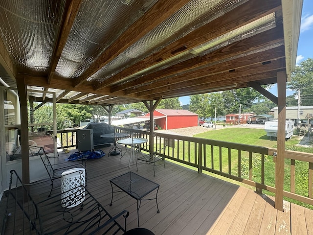 wooden terrace with a yard