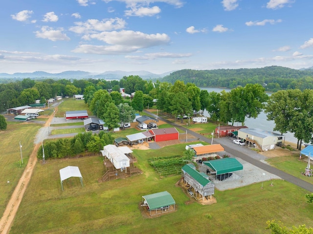 birds eye view of property featuring a water and mountain view