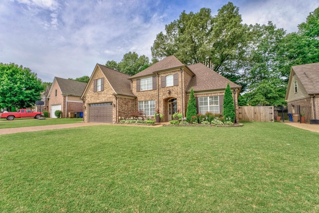 view of front of house featuring a garage and a front yard