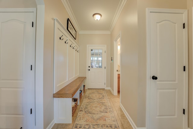 mudroom featuring crown molding and light tile patterned flooring