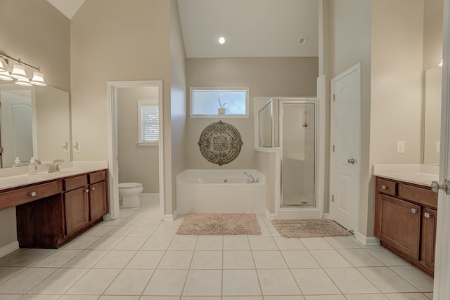 full bathroom with high vaulted ceiling, independent shower and bath, tile patterned flooring, vanity, and toilet