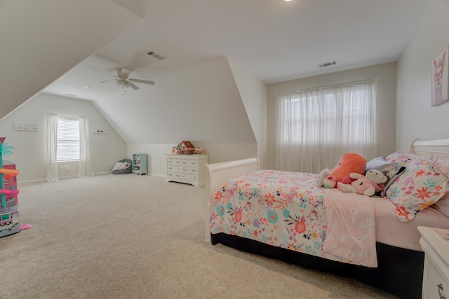 bedroom with vaulted ceiling, ceiling fan, and carpet flooring