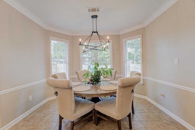 tiled dining space featuring an inviting chandelier and crown molding