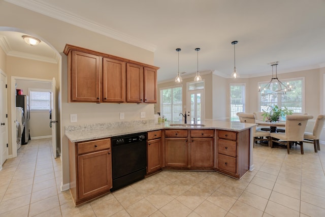 kitchen with light stone countertops, dishwasher, sink, and hanging light fixtures