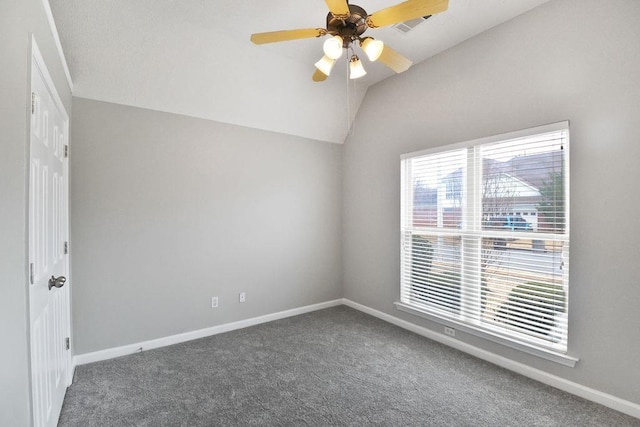 carpeted empty room with ceiling fan and vaulted ceiling