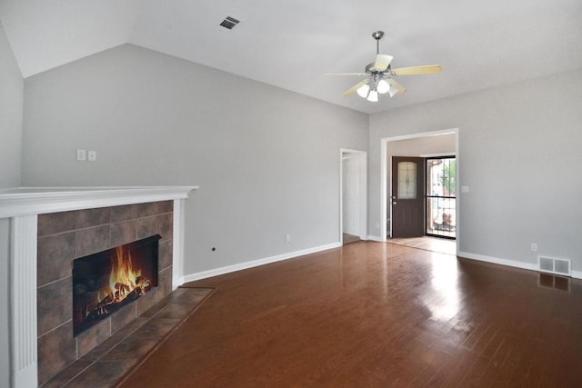 unfurnished living room featuring hardwood / wood-style flooring, ceiling fan, a fireplace, and vaulted ceiling