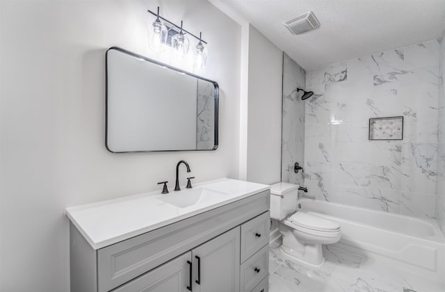 full bathroom with vanity, toilet, tiled shower / bath combo, and a textured ceiling