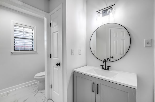 bathroom with vanity and toilet