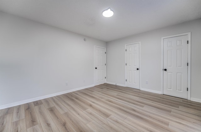 unfurnished bedroom with light hardwood / wood-style floors