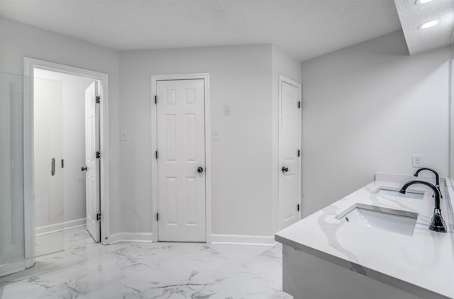 bathroom featuring vanity and a textured ceiling