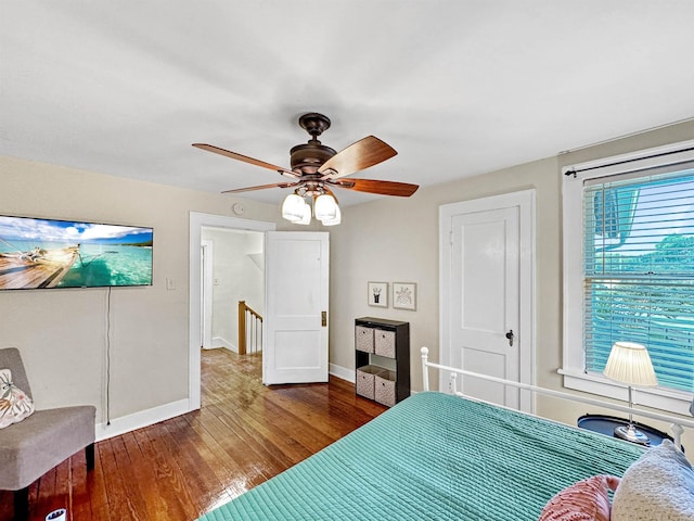 bedroom featuring hardwood / wood-style floors and ceiling fan