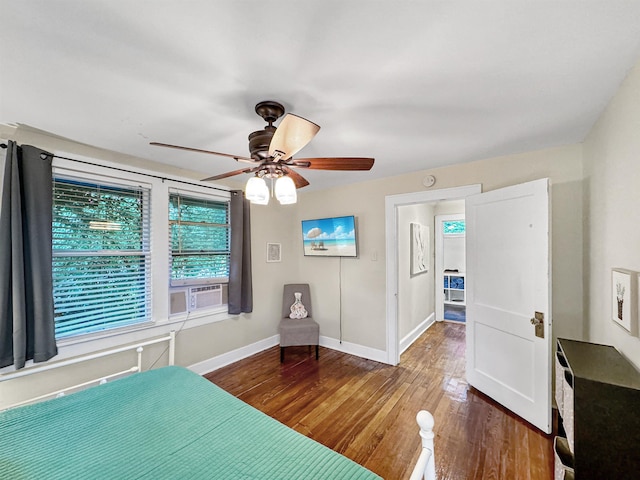 unfurnished bedroom featuring ceiling fan and dark hardwood / wood-style flooring