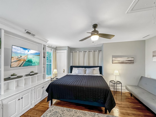 bedroom with ceiling fan and dark hardwood / wood-style flooring