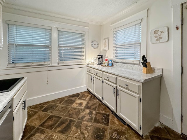 kitchen featuring a textured ceiling, ornamental molding, dishwasher, and white cabinets