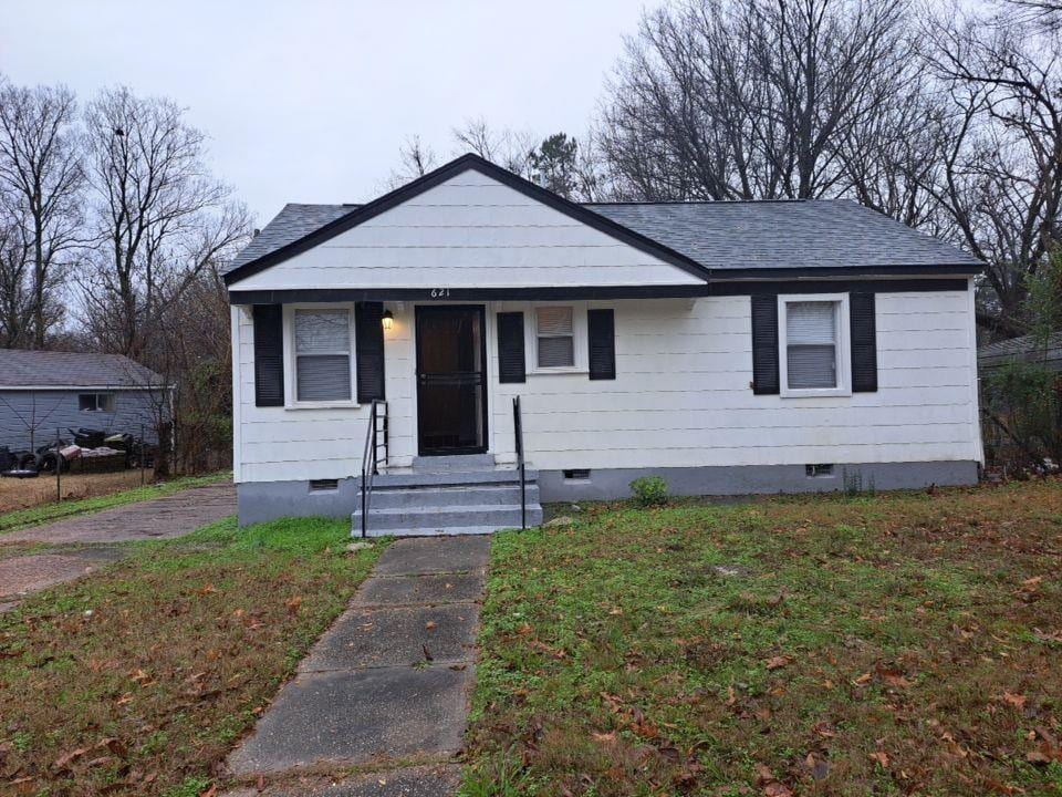 bungalow with a front lawn