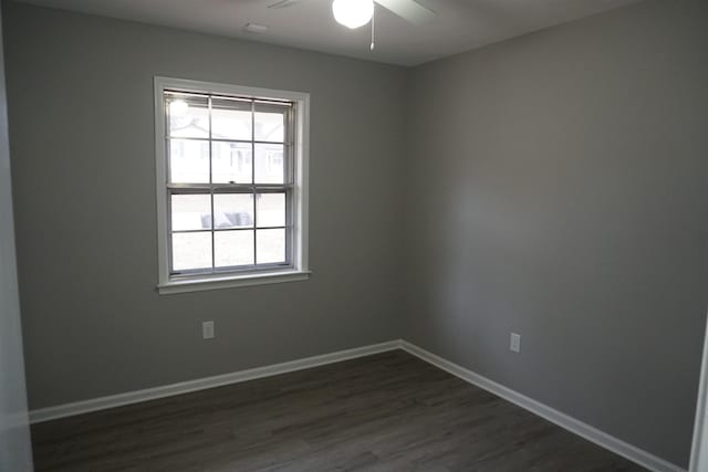 unfurnished room with dark hardwood / wood-style floors and ceiling fan