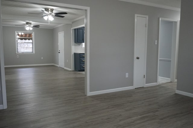 spare room with ornamental molding, ceiling fan, and dark hardwood / wood-style flooring