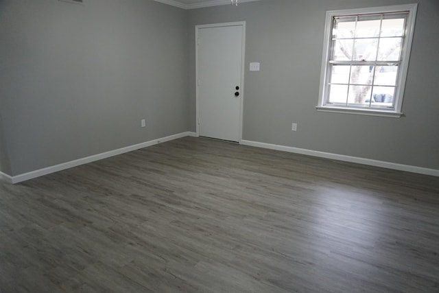 spare room with dark hardwood / wood-style floors