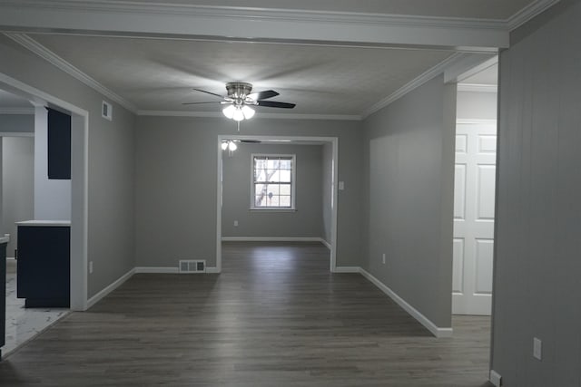 spare room with dark hardwood / wood-style flooring, ornamental molding, and ceiling fan