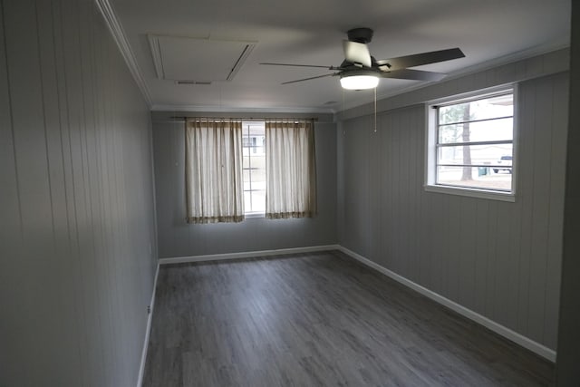 empty room with ceiling fan, ornamental molding, and hardwood / wood-style floors