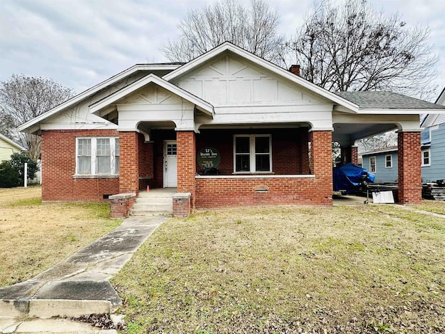 bungalow-style house featuring a front yard